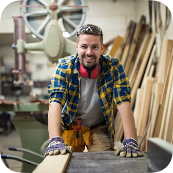 Portrait Young Motivated Carpenter Standing By Woodworking Machine His Carpentry Workshop 1 1