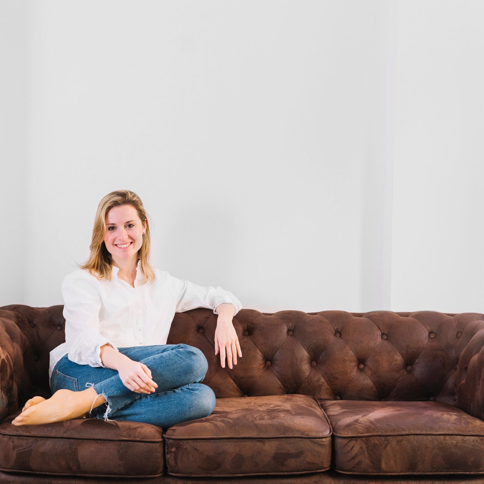 smiling woman sofa